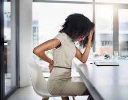 Photo of woman sitting in pain